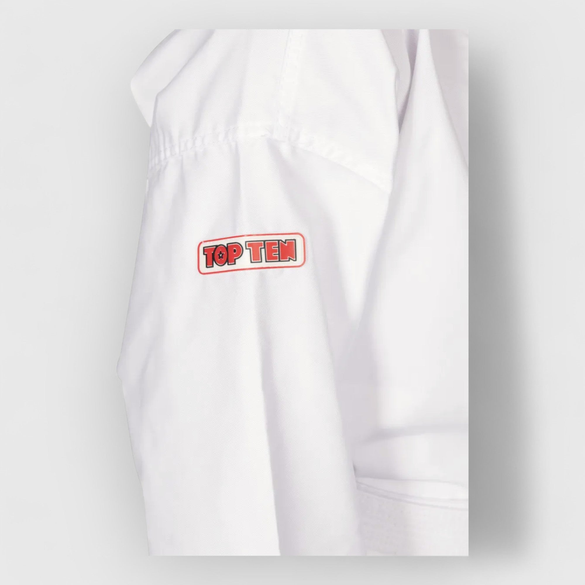 TOP TEN Elite Kyong ITF Nybegynnerdrakt for barn (ITF godkjent) - CombatStore.no